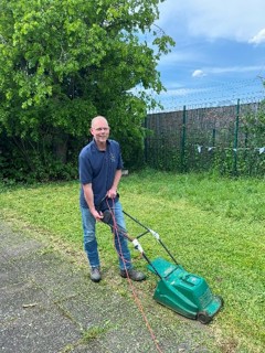 A person holding a lawnmower

AI-generated content may be incorrect., Picture